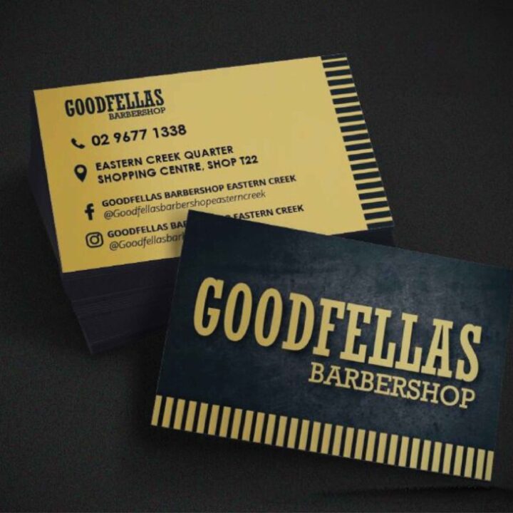 A creamish yellow business card featuring a sleek comb design, symbolizing the classic and modern fusion of Barber Shop Business Card Eastern Creek location, designed by RooVista Designs.