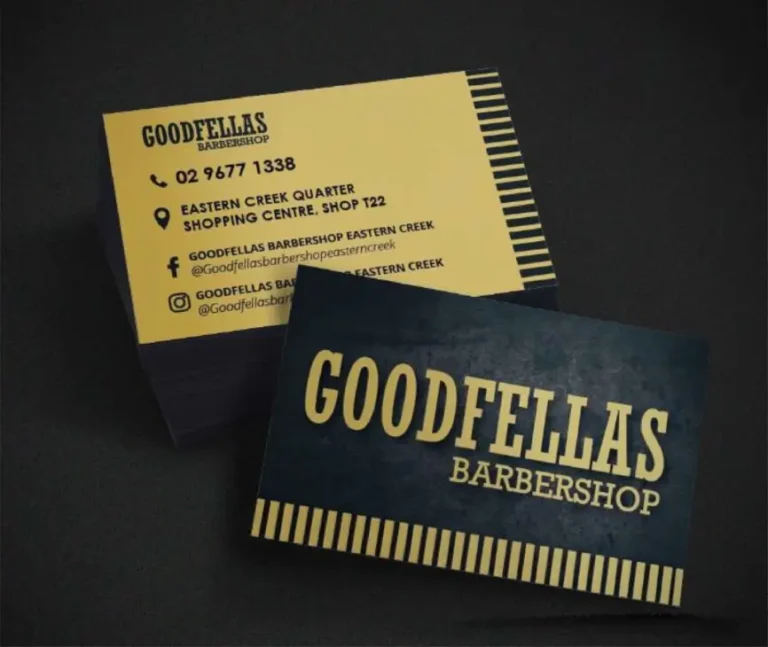 A stylish business card for a barbershop, featuring a clean design with the barbershop logo, contact information, and classic barber pole imagery in the background.